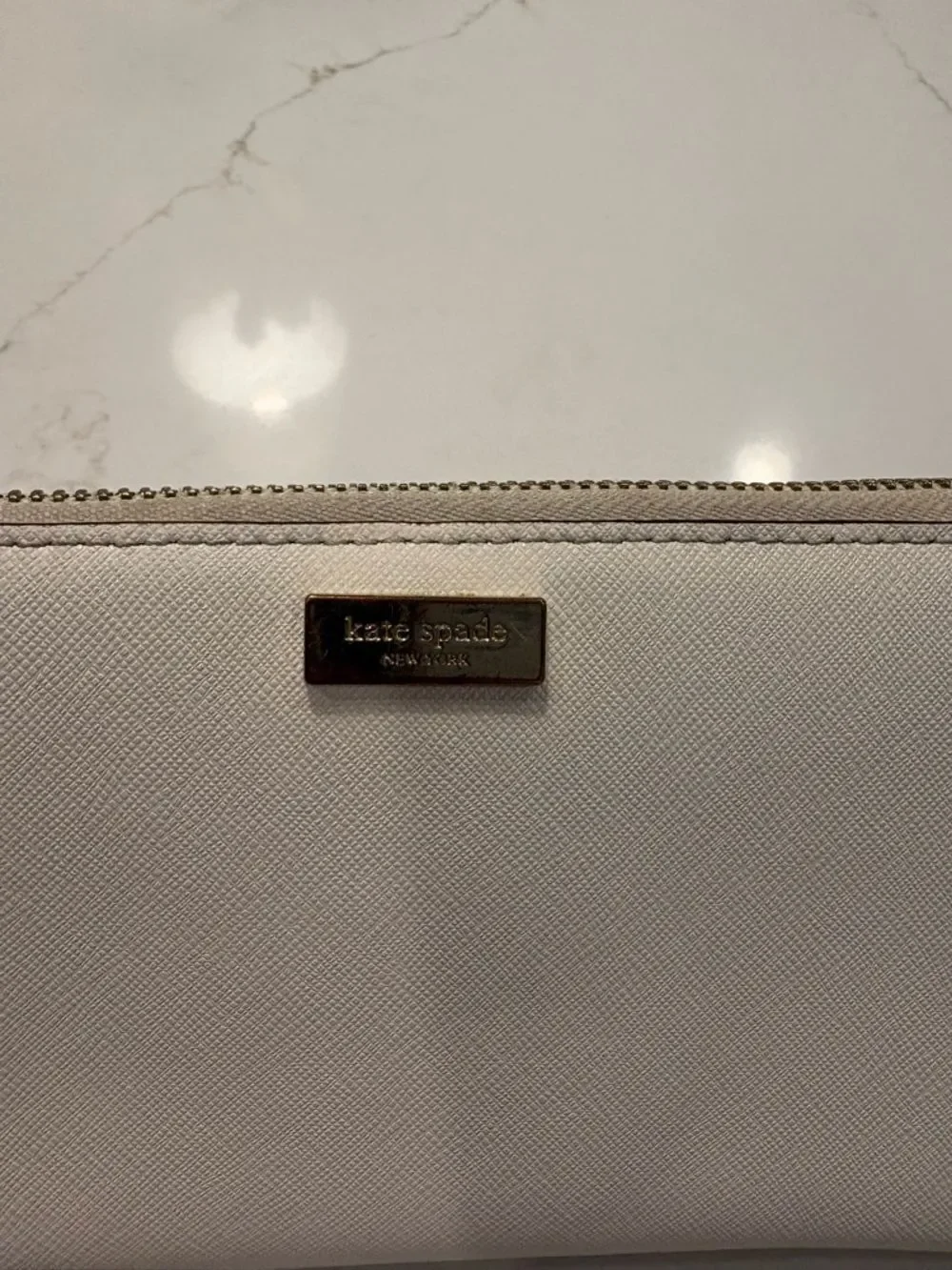 Kate Spade New York Cream Zip Wallet with Gold Plaque